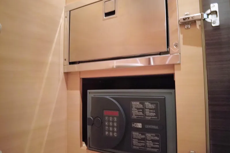 Raven Yacht Photos Pics Secure safe inside 2014 Azimut 54 Fly Bridge yacht cabin, featuring digital keypad.