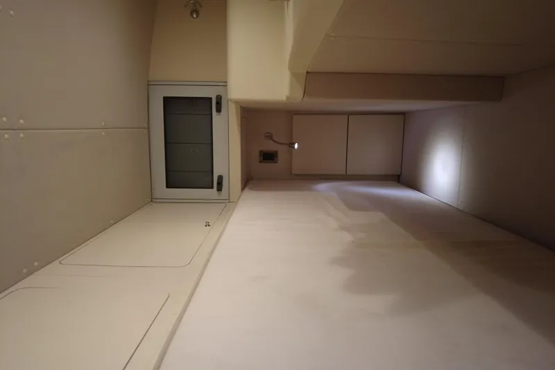 Raven Yacht Photos Pics Interior cabin space of 2014 Azimut 54 Fly Bridge yacht, featuring storage compartments.