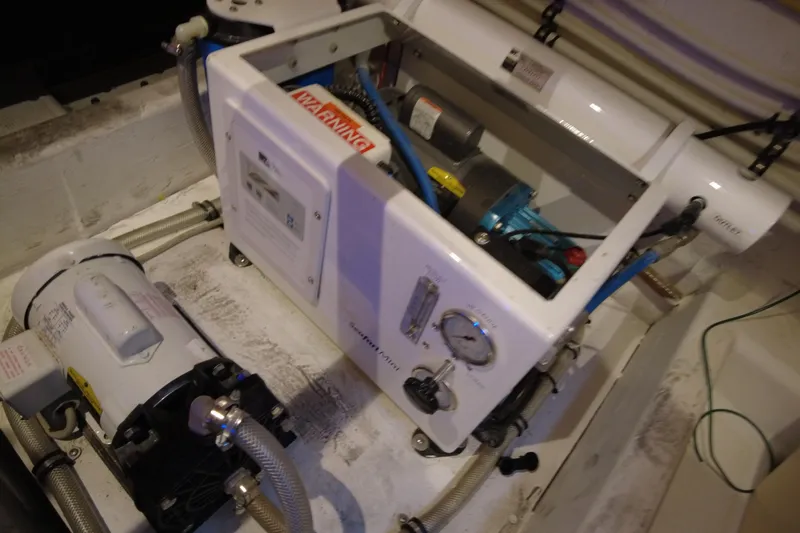 Raven Yacht Photos Pics Engine room of 2014 Azimut 54 Fly Bridge yacht, showcasing mechanical components.