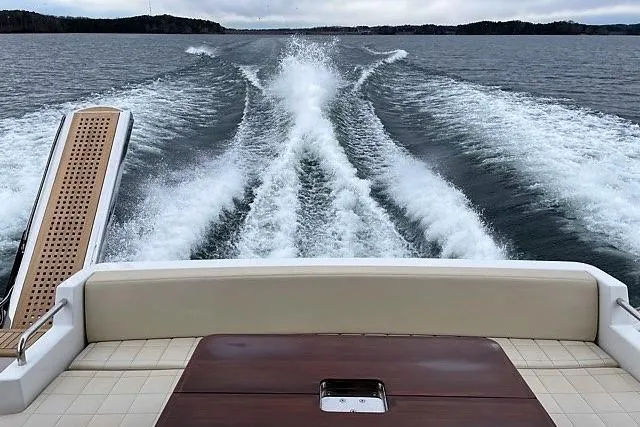 Raven Yacht Photos Pics 2014 Azimut 54 Fly Bridge yacht cruising on open water, view from the deck.