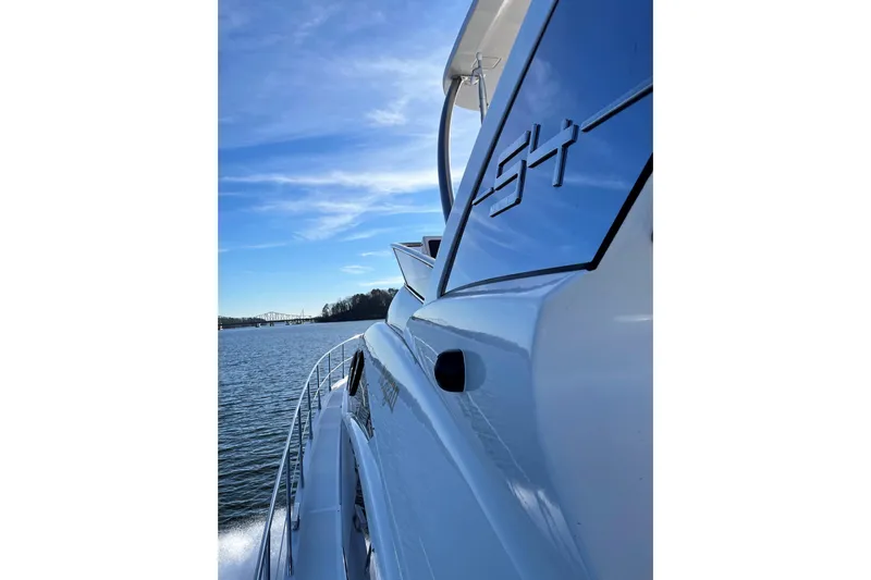 Raven Yacht Photos Pics Azimut 54 Fly Bridge 2014 yacht cruising on a sunny day, side view.