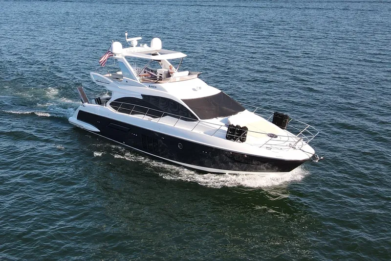 Raven Yacht Photos Pics 2014 Azimut 54 Fly Bridge yacht cruising on open water.