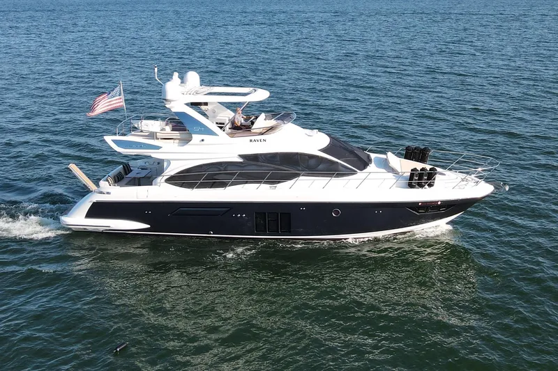 Raven Yacht Photos Pics 2014 Azimut 54 Fly Bridge yacht cruising on open water.