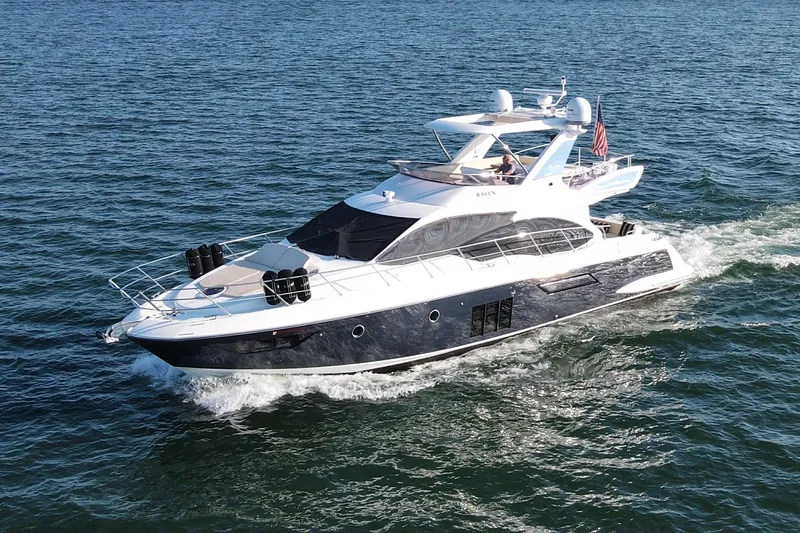 Raven Yacht Photos Pics Luxurious 2014 Azimut 54 Fly Bridge yacht cruising on open water.