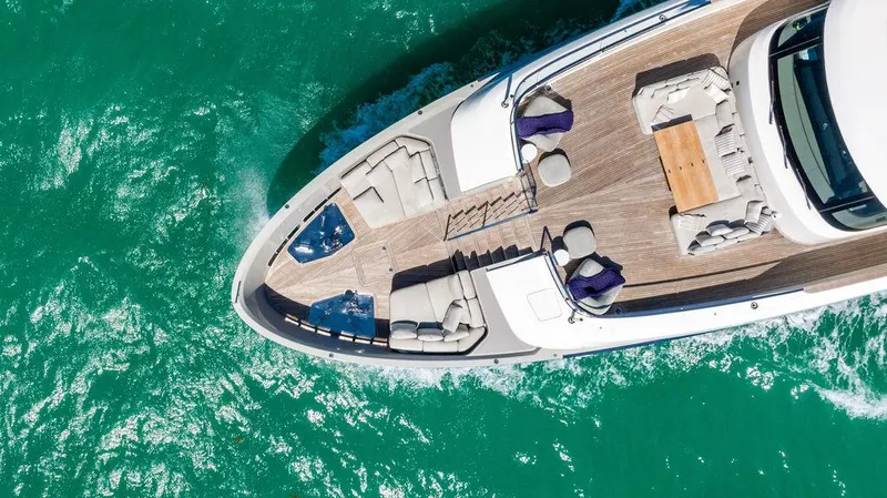 The Wolf Yacht Photos Pics Aerial view of 2023 Sanlorenzo SD118 yacht cruising on turquoise waters.
