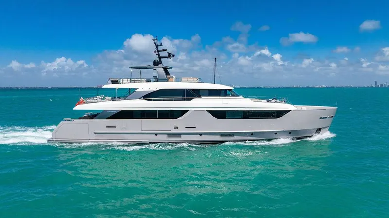 The Wolf Yacht Photos Pics 2023 Sanlorenzo SD118 yacht cruising on turquoise ocean under clear blue sky.