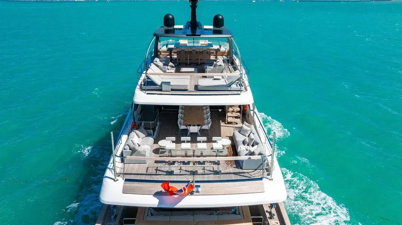The Wolf Yacht Photos Pics Luxurious 2023 Sanlorenzo SD118 yacht cruising on turquoise waters, showcasing elegant multi-level decks.