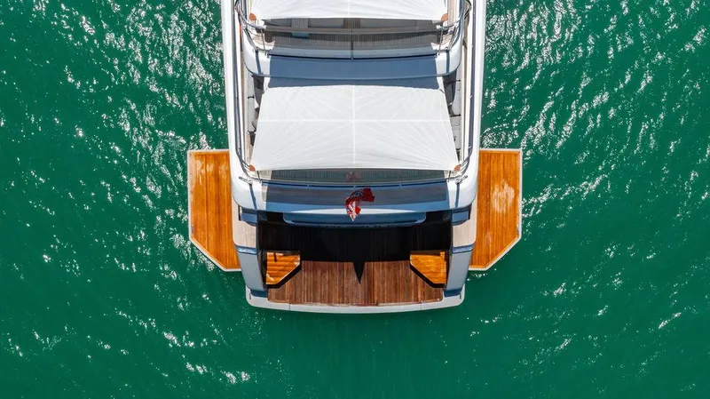 The Wolf Yacht Photos Pics Aerial view of 2023 Sanlorenzo SD118 yacht on turquoise water.