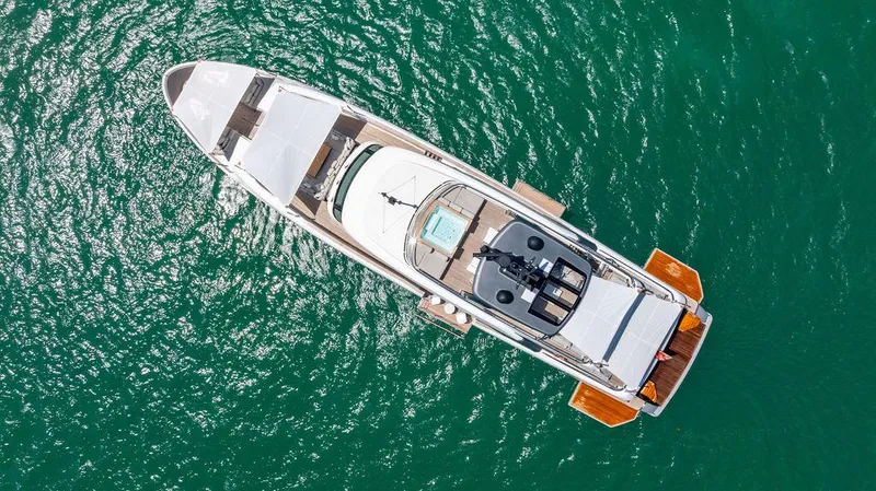 The Wolf Yacht Photos Pics Aerial view of 2023 Sanlorenzo SD118 yacht on turquoise water.
