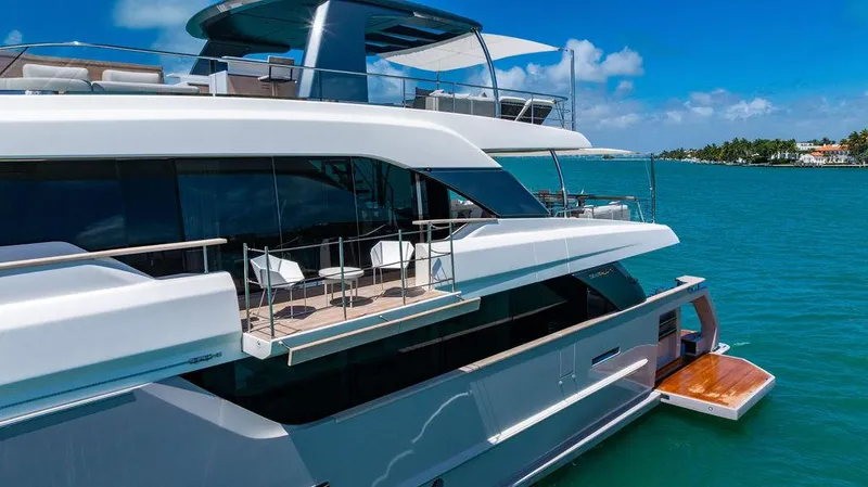 The Wolf Yacht Photos Pics Luxurious 2023 Sanlorenzo SD118 yacht on serene blue waters, featuring elegant deck design.