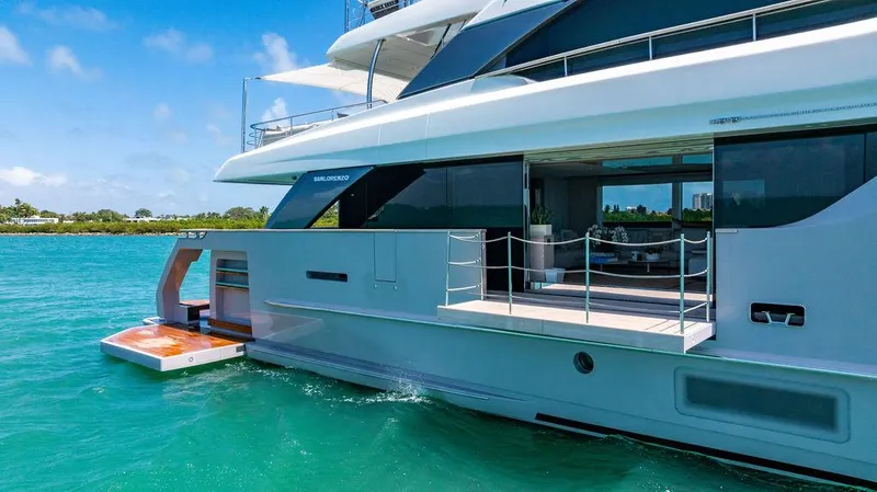 The Wolf Yacht Photos Pics 2023 Sanlorenzo SD118 yacht on turquoise water, showcasing sleek design and luxury features.