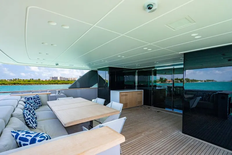 The Wolf Yacht Photos Pics Luxurious 2023 Sanlorenzo SD118 yacht deck with elegant seating and ocean view.