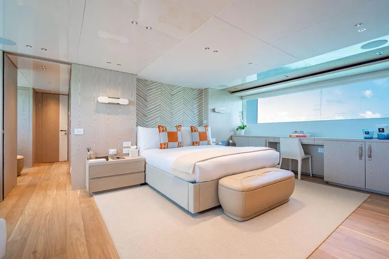 The Wolf Yacht Photos Pics Luxurious bedroom interior on 2023 Sanlorenzo SD118 yacht, featuring modern design and large window.