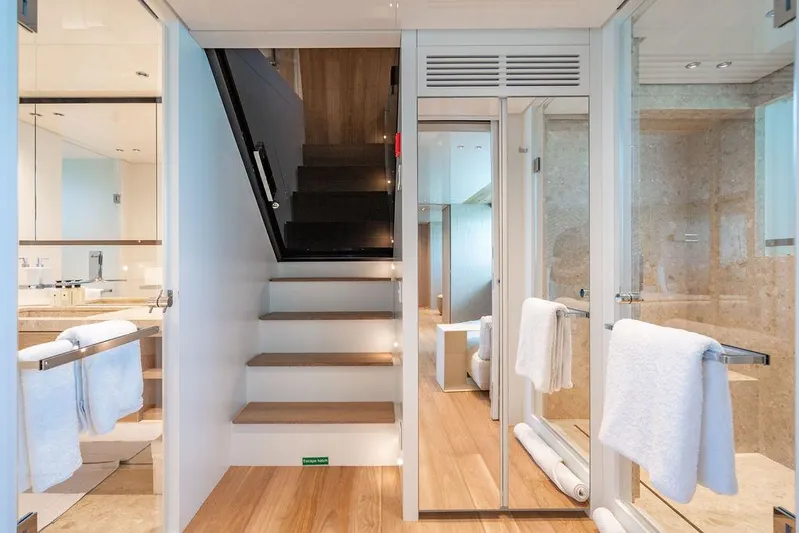 The Wolf Yacht Photos Pics Luxurious interior of 2023 Sanlorenzo SD118 yacht, featuring elegant staircase and modern bathroom design.