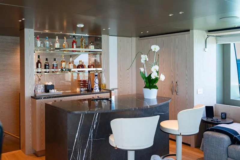 The Wolf Yacht Photos Pics Luxurious bar area on 2023 Sanlorenzo SD118 yacht with elegant seating and decor.