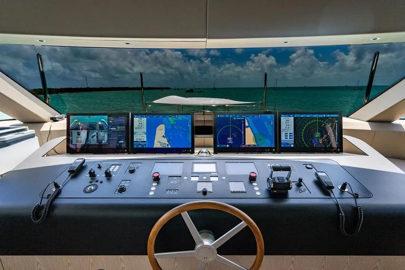 The Wolf Yacht Photos Pics Control panel of 2023 Sanlorenzo SD118 yacht with navigation screens and ocean view.