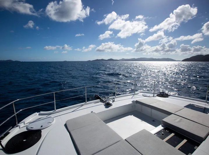 Wild Blue Yacht Photos Pics 2019 Fountaine Pajot MY 44 yacht deck with ocean view and clear sky.