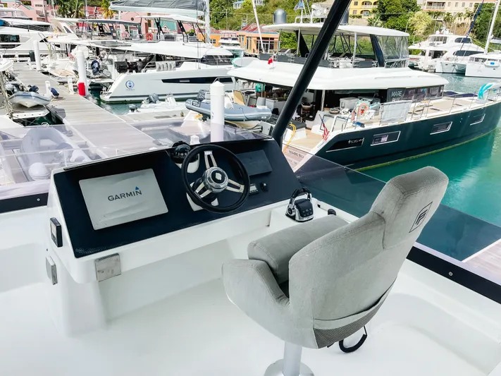 Wild Blue Yacht Photos Pics Helm of 2019 Fountaine Pajot MY 44 yacht with Garmin navigation, docked in marina.