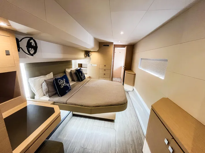 Wild Blue Yacht Photos Pics Luxurious cabin interior of 2019 Fountaine Pajot MY 44 yacht, featuring modern design and cozy bedding.