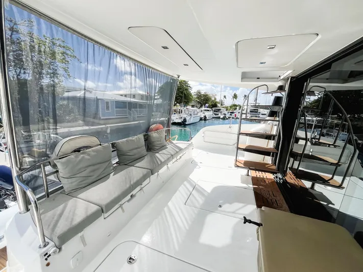 Wild Blue Yacht Photos Pics Luxurious 2019 Fountaine Pajot MY 44 yacht deck with seating and marina view.