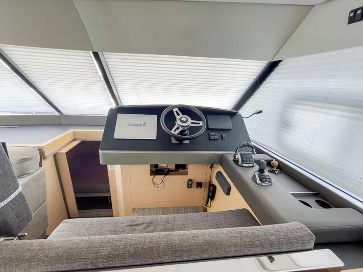 Wild Blue Yacht Photos Pics Helm station of 2019 Fountaine Pajot MY 44 yacht with modern controls and seating.