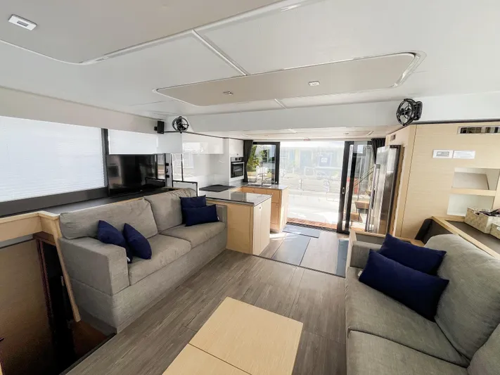 Wild Blue Yacht Photos Pics Luxurious interior of 2019 Fountaine Pajot MY 44 yacht with modern furnishings and spacious layout.