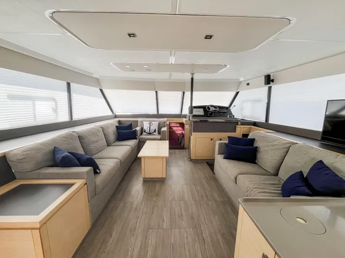 Wild Blue Yacht Photos Pics Luxurious interior of 2019 Fountaine Pajot MY 44 yacht with modern seating and helm.