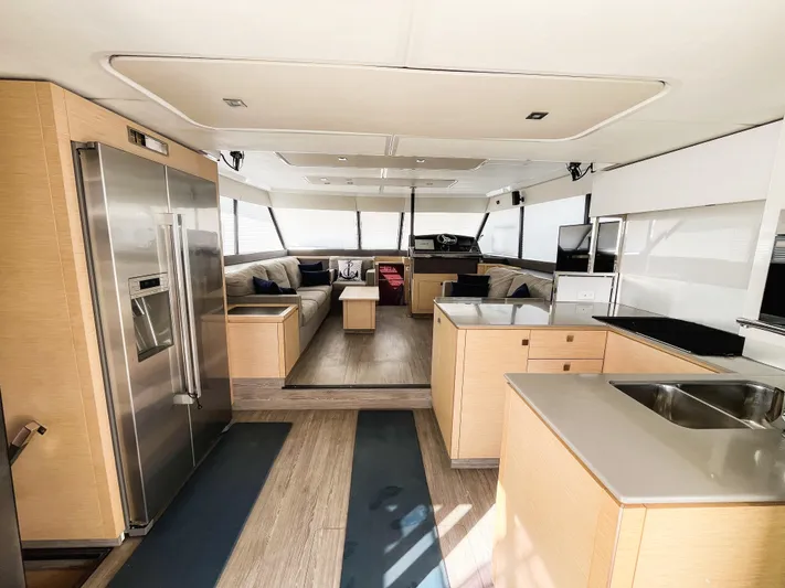 Wild Blue Yacht Photos Pics Luxurious interior of 2019 Fountaine Pajot MY 44 yacht with modern kitchen and spacious seating area.