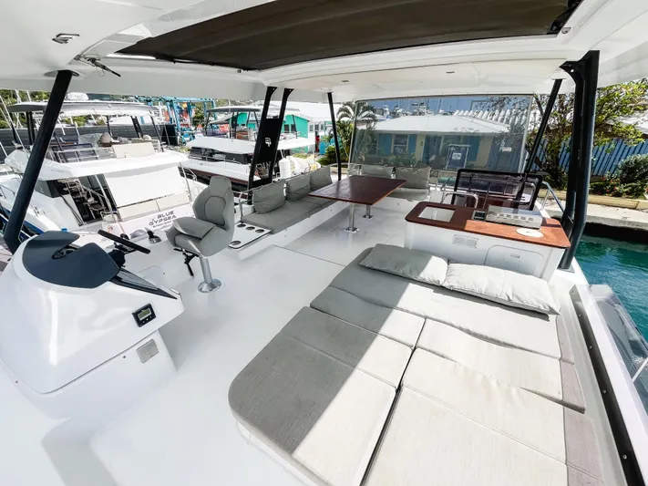 Wild Blue Yacht Photos Pics Luxurious 2019 Fountaine Pajot MY 44 yacht interior with spacious seating and helm station.