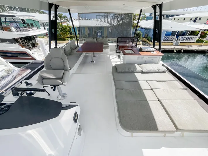 Wild Blue Yacht Photos Pics Luxurious 2019 Fountaine Pajot MY 44 yacht deck with seating and sunbathing area.