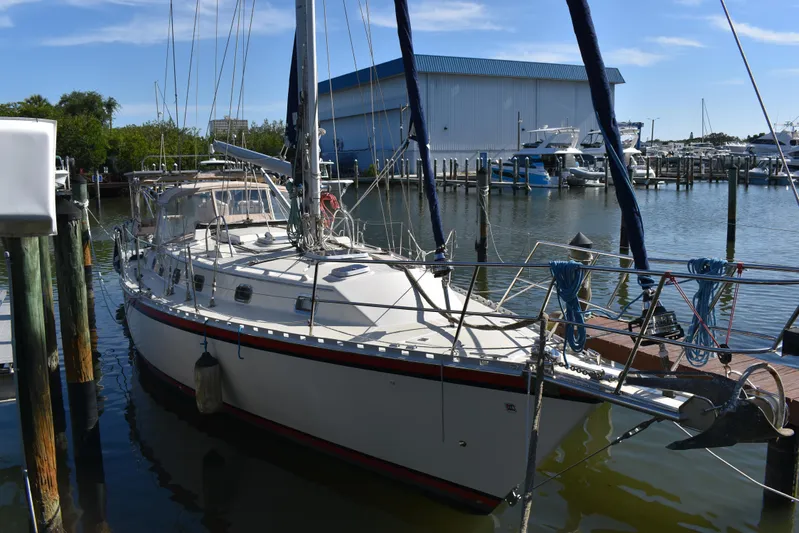 Jellyfish Problems Yacht Photos Pics 2008 Caliber 40 LRC SE sailboat docked at marina with blue sky background.