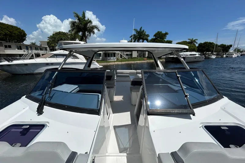  Yacht Photos Pics 2020 Aquila 36 Sport boat docked, featuring sleek design and spacious deck.