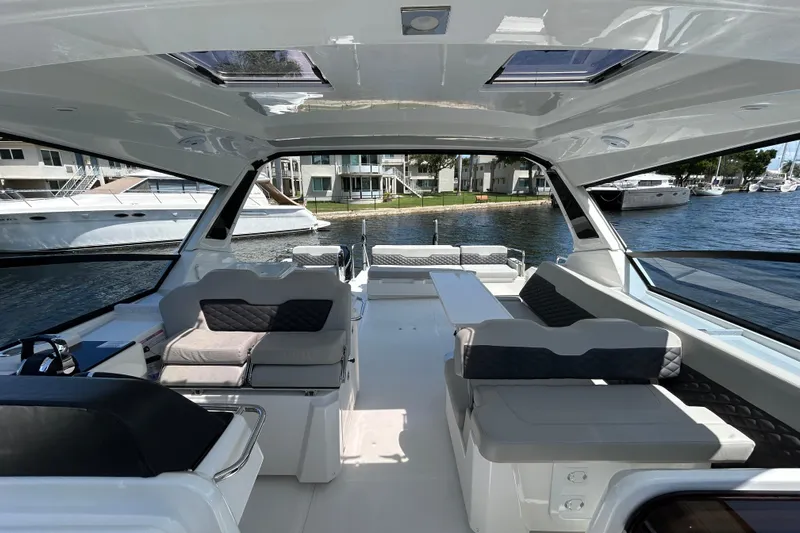  Yacht Photos Pics Interior view of 2020 Aquila 36 Sport yacht, featuring spacious seating and modern design.