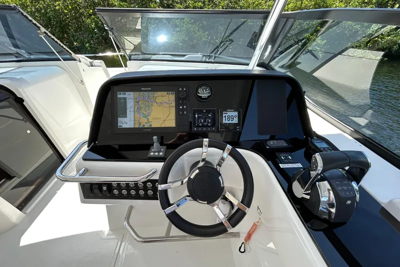  Yacht Photos Pics Helm of 2020 Aquila 36 Sport boat with navigation display and controls.