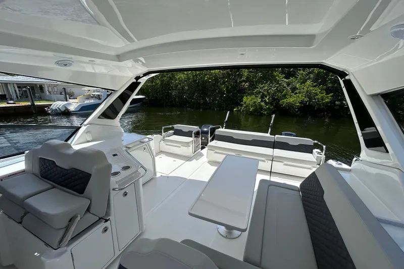  Yacht Photos Pics Interior view of 2020 Aquila 36 Sport boat with seating and table.