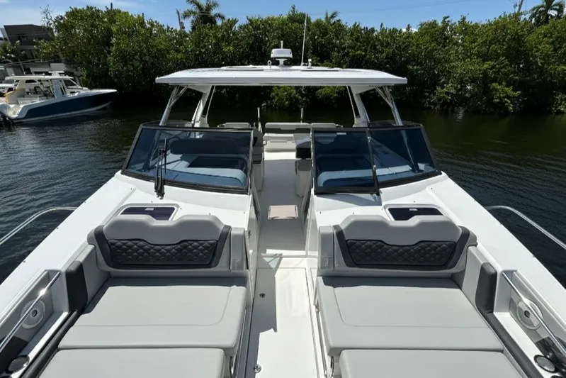  Yacht Photos Pics Aquila 36 Sport 2020 boat with sleek design and spacious seating on a sunny day.