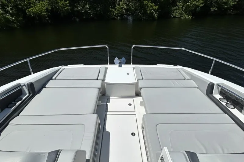  Yacht Photos Pics Aquila 36 Sport 2020 boat with spacious sunbathing deck on calm water.