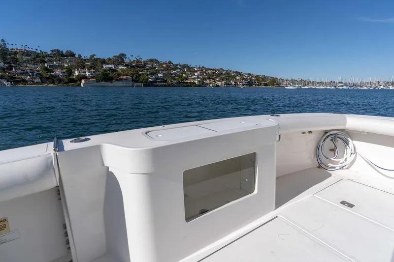 Tomahawk Yacht Photos Pics 2008 Cabo 40 Express boat deck with ocean and coastal view.