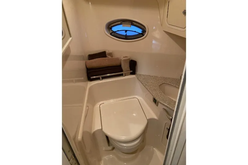 Co Motion Yacht Photos Pics 2008 Sea Ray 44 Sundancer yacht bathroom with modern fixtures and porthole window.