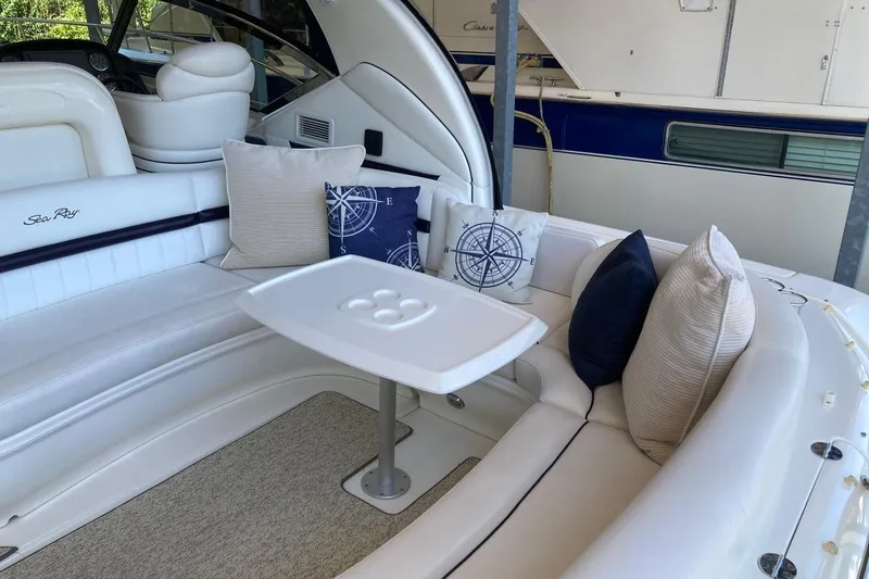 Co Motion Yacht Photos Pics Luxurious 2008 Sea Ray 44 Sundancer yacht interior with plush seating and nautical-themed pillows.