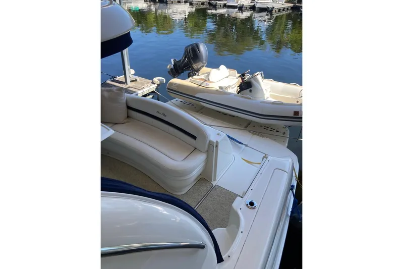 Co Motion Yacht Photos Pics 2008 Sea Ray 44 Sundancer yacht interior with seating, docked by calm waters.