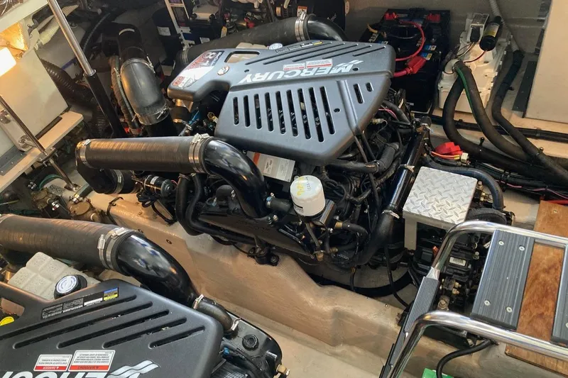 Co Motion Yacht Photos Pics Engine room of a 2008 Sea Ray 44 Sundancer with Mercury engines and various components.