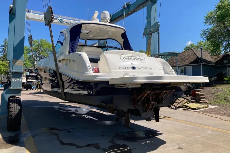 Co Motion Yacht Photos Pics 2008 Sea Ray 44 Sundancer yacht on lift, sunny day, marina setting.