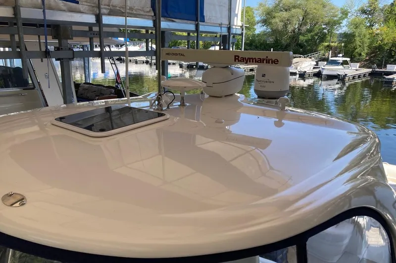 Co Motion Yacht Photos Pics 2008 Sea Ray 44 Sundancer yacht with Raymarine radar, docked at a marina.