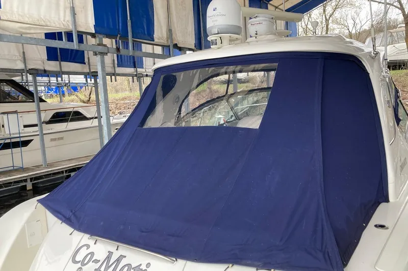 Co Motion Yacht Photos Pics 2008 Sea Ray 44 Sundancer yacht with blue canvas cover in marina.