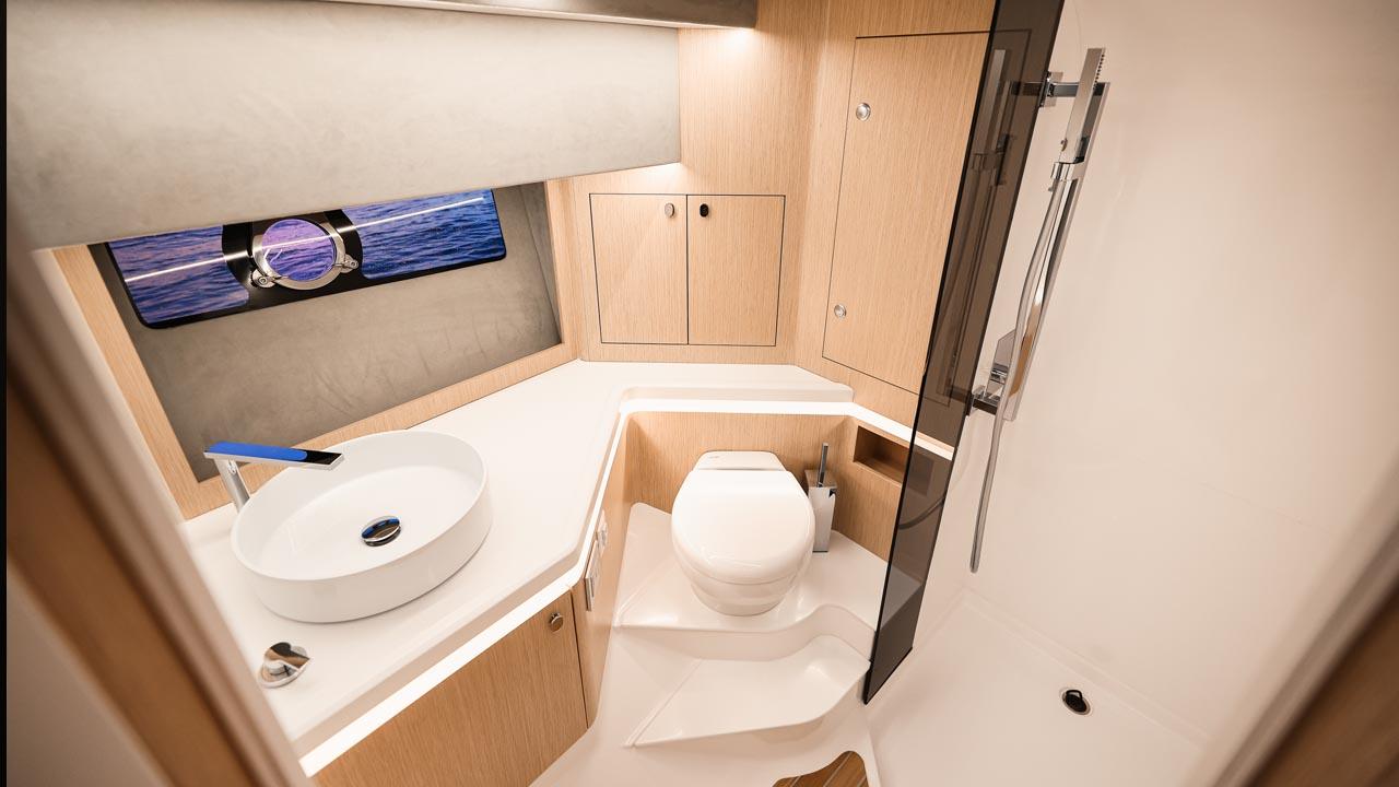 Modern bathroom interior of 2023 Focus Forza 37 yacht with sleek fixtures and ocean view.
