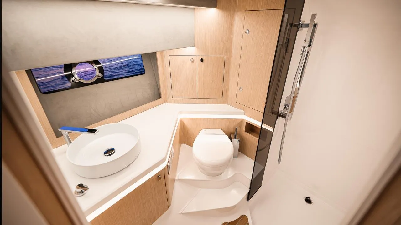 Modern bathroom interior of 2023 Focus Forza 37 yacht with sleek fixtures and ocean view.