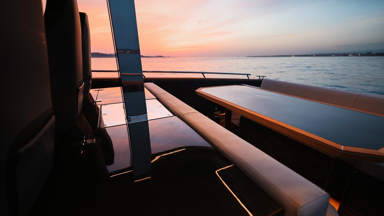 Luxurious 2023 Focus Forza 37 yacht interior at sunset, overlooking serene ocean waters.