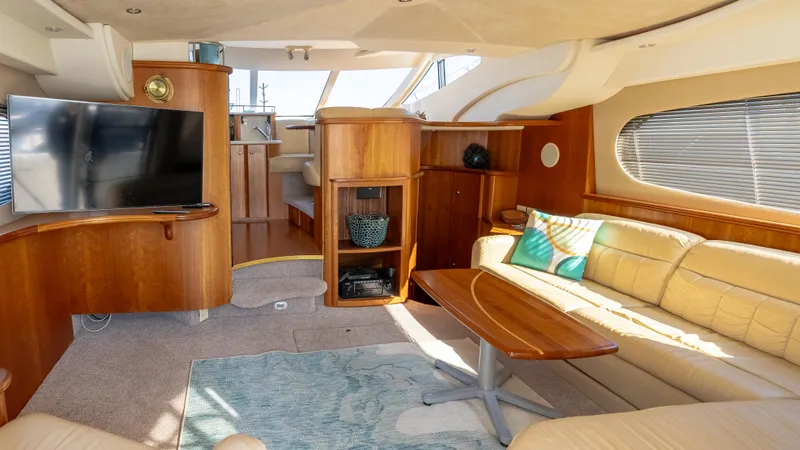  Yacht Photos Pics Luxurious interior of 2002 Silverton 41 Sport Bridge yacht with elegant wood finishes.