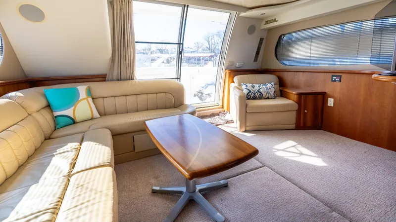  Yacht Photos Pics Luxurious interior of 2002 Silverton 41 Sport Bridge yacht with plush seating and modern decor.